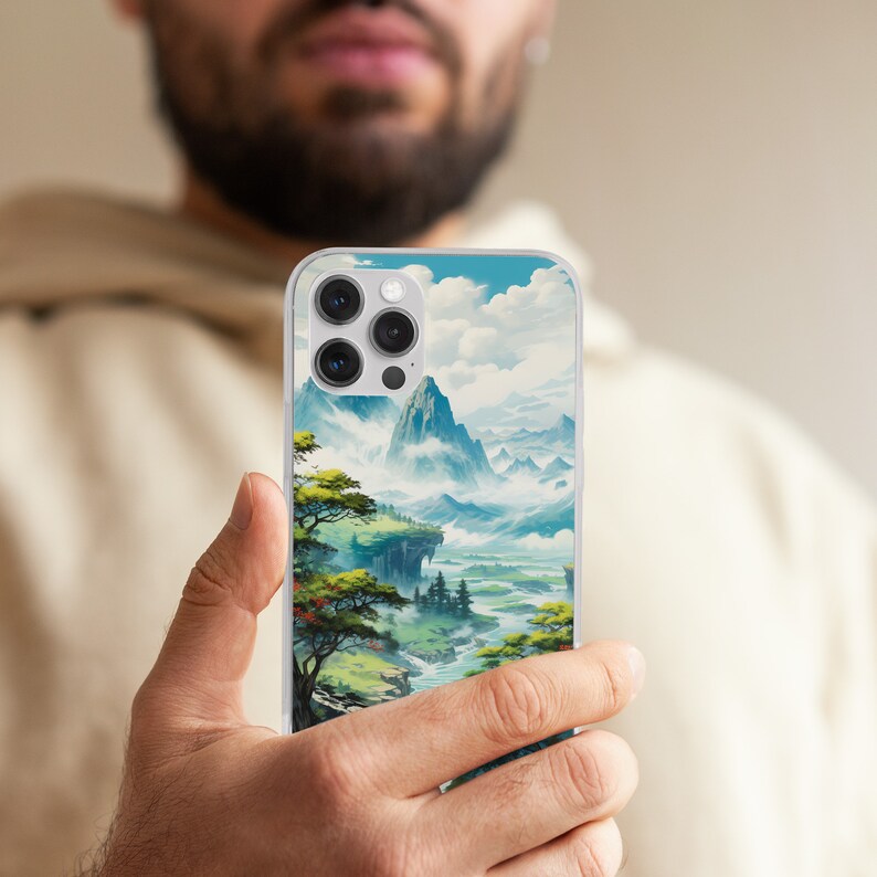 a man holding up a phone case with a painting on it