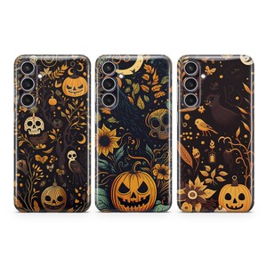 May include: Three black phone cases with a Halloween theme. Each case features a different design with pumpkins, skulls, and other spooky elements. The cases are all black with a matte finish.