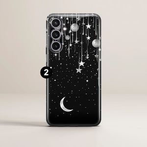May include: A clear phone case with a black background and a design of white stars, a crescent moon, and planets. The case has a cutout for a triple camera lens.