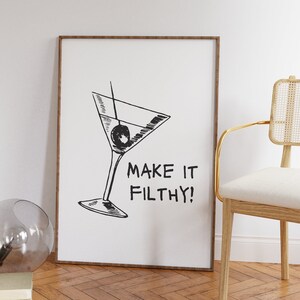 Printable wall art. Black and white. Fine line drawing of a martini with the text MAKE IT FILTHY! beside it. Multiple sizes available in description. Instant download.