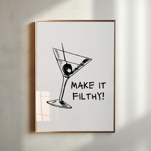 May include: A black and white illustration of a martini glass with an olive, and the text "MAKE IT FILTHY!" on a white background.