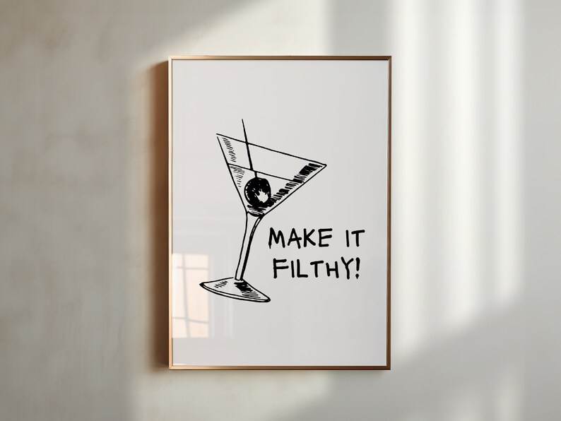 May include: A black and white illustration of a martini glass with an olive, and the text "MAKE IT FILTHY!" on a white background.