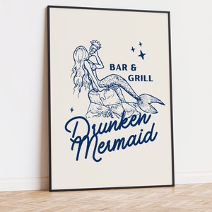 May include: A framed illustration of a mermaid drinking from a seashell with the text "Bar & Grill Drunken Mermaid" in blue.