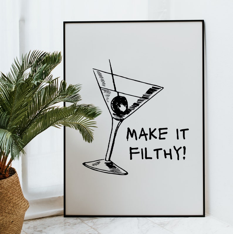 May include: Black and white illustration of a martini glass with an olive, and the text "MAKE IT FILTHY!" on a white background.