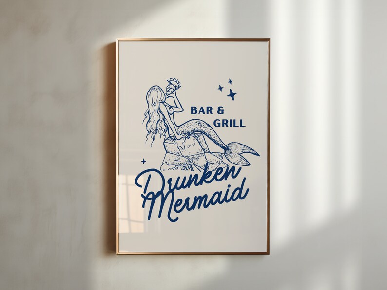 May include: A blue and white illustration of a mermaid holding a seashell, sitting on a rock. The text "Bar & Grill" and "Drunken Mermaid" is below the mermaid.
