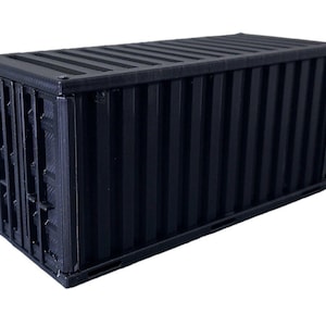 May include: A black metal shipping container with a corrugated metal exterior.
