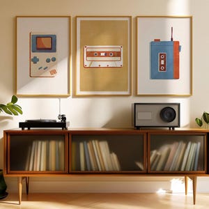 a room with a record player, a radio, a plant and pictures on the