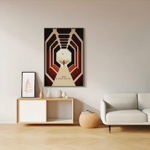 a living room with a white couch and a poster on the wall