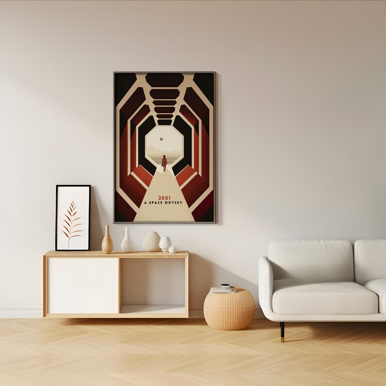 a living room with a white couch and a poster on the wall