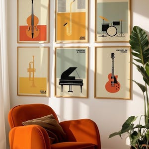 May include: A set of six framed wall art prints featuring musical instruments including a double bass, saxophone, drum kit, trumpet, grand piano, and electric guitar, each with text labels like Lon Notee, Velvet Nights, and Heartbeat of Sound.