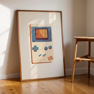 a picture of a nintendo gameboy on a wall next to a stool