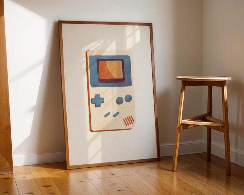 a picture of a nintendo gameboy on a wall next to a stool