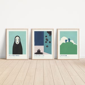 three minimalist posters are displayed on a wall
