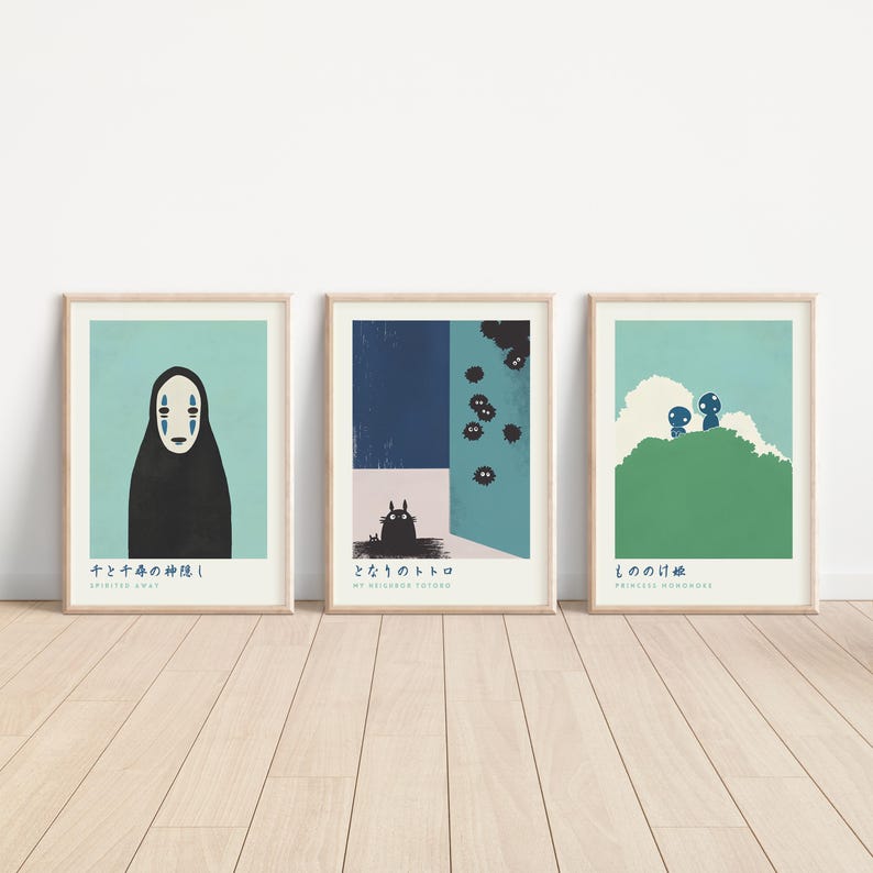 three minimalist posters are displayed on a wall
