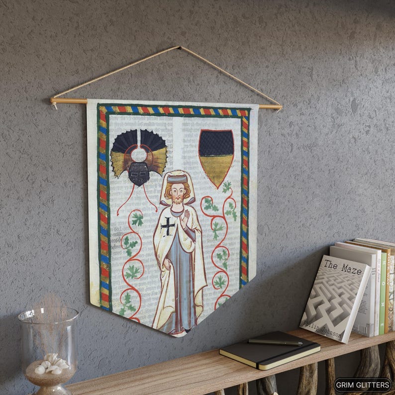 May include: A medieval-style tapestry featuring a white-robed figure with a cross on their chest, a black and gold shield, and a decorative design of vines and leaves. The tapestry is framed with a red, blue, and gold border.