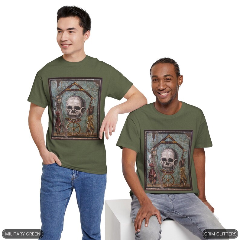 May include: Two men wearing olive green t-shirts with a graphic print of a skull in a mosaic frame. The text "Grim Glitters" is printed on the bottom right of the image. The text "Military Green" is printed on the bottom left of the image.