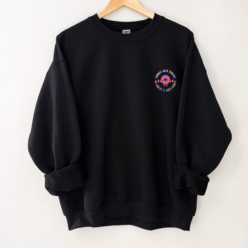 May include: Black sweatshirt with a donut graphic and the text "Donut Just Work Hard, Hustle & Lift Heavy".