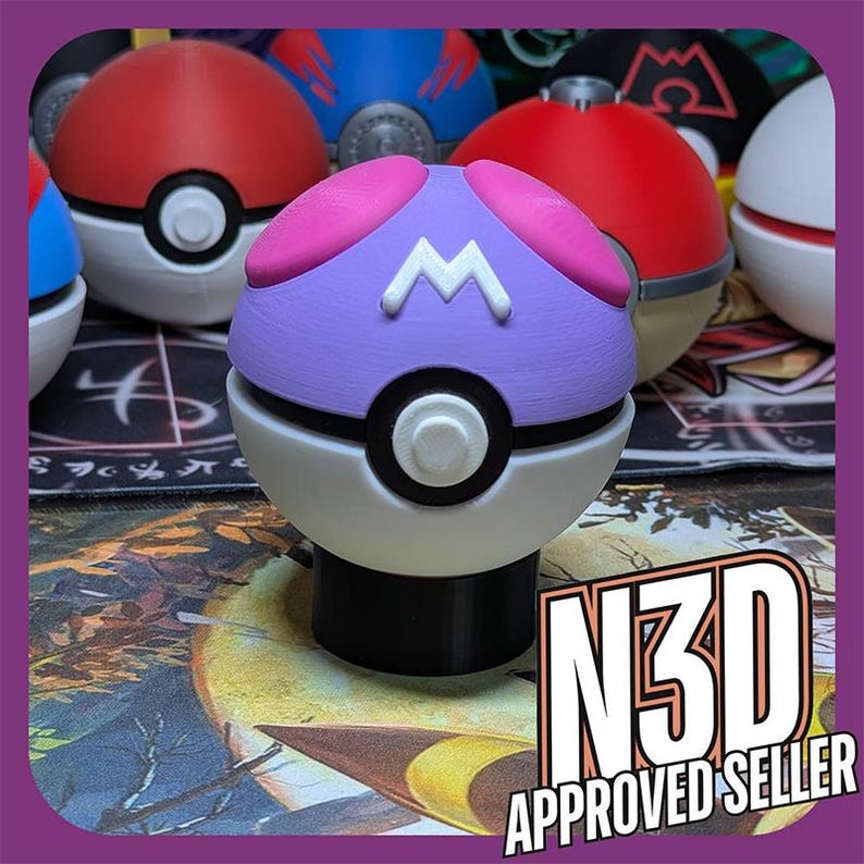 May include: A purple and white Pokeball with a pink M on the top. The Pokeball is sitting on a black base.