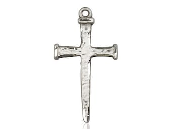May include: A silver hammered nail cross pendant. The cross is made of metal and has a hammered texture. The pendant is designed to be worn as a necklace.