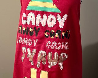 Apron with raw edge appliqued words "Candy, Candy Corns, Candy Canes, Syrup" with Elf hat and shoes.