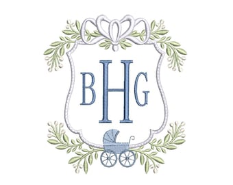 May include: Embroidered design featuring the letters BHG in blue within a white shield shape. A baby carriage is at the bottom, and the shield is surrounded by green leaves and white accents. A white bow is at the top.