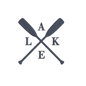 May include: A navy blue design featuring two crossed oars, with the word "LAKE" spelled out using individual letters. The oars are detailed with textured patterns, set against a clean white background.