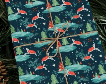 May include: A blue gift box with a Christmas-themed wrapping paper featuring a repeating pattern of red and brown sea turtles swimming in a blue ocean with white snowflakes and green pine trees. The box is tied with brown twine.