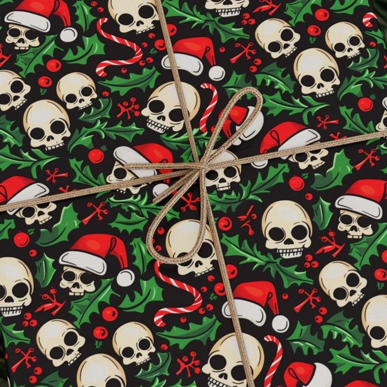 May include: Black and green wrapping paper with a repeating pattern of white skulls wearing Santa hats, candy canes, holly leaves, and red berries.
