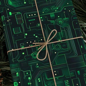 May include: Green and black patterned gift wrap with a circuit board design. The wrap is tied with brown twine.
