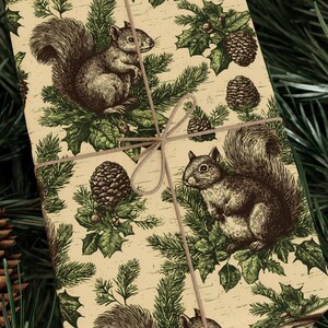 May include: Gift-wrapped parcel with a repeating pattern of squirrels, pinecones, and evergreen branches in brown and green on a cream background. Tied with twine.