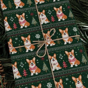 May include: Green wrapping paper with a repeating pattern of corgi dogs wearing festive sweaters, Christmas trees, and snowflakes. The gift is tied with twine.