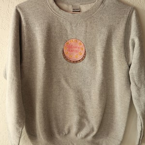 Embroidered Welcome Home Cake Crewneck.