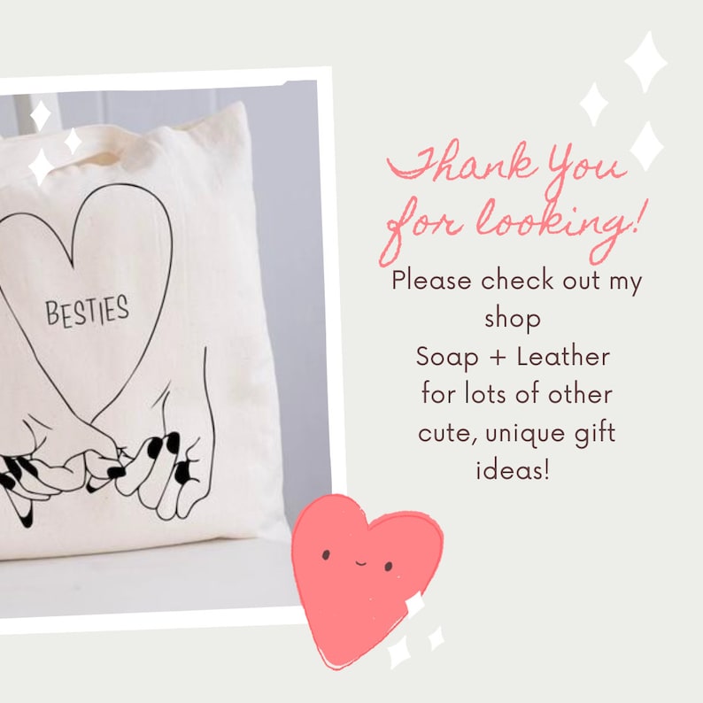 May include: A cream-colored canvas tote bag featuring a black line art illustration of two hands interlocking pinky fingers inside a heart shape with the word BESTIES printed inside. The bag is displayed alongside text that reads Thank You for looking.