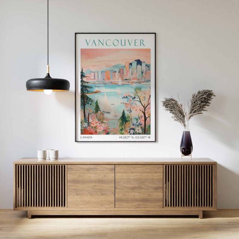 May include: A vintage travel poster featuring a colorful illustration of the Vancouver skyline with boats in the water and trees in the foreground. The poster reads "Vancouver, Canada, 49.2827&deg; N, 123.1207&deg; W."