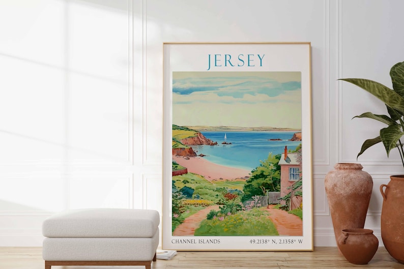 May include: A framed print of Jersey, Channel Islands, depicting a coastal scene with a beach, sea, and a sailboat. The artwork has a vintage style with a light blue sky and a pinkish-beige beach. The print is in a gold frame.