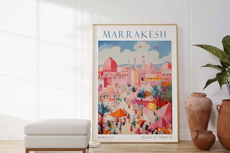 May include: A vintage travel poster for Marrakesh, Morocco. The poster features a colorful illustration of the city's architecture and a bustling marketplace. The text "MARRAKESH" is in a bold blue font at the top of the poster. The coordinates "31.6225&deg; N, 7.9988&deg; W" are printed at the bottom of the poster.