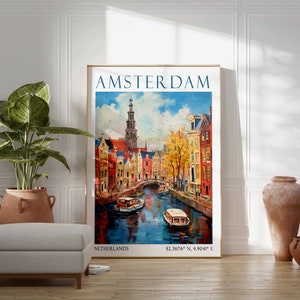 May include: A vintage travel poster with a colourful illustration of Amsterdam, Netherlands. The poster features a canal with boats, buildings, and a tall church steeple. The text on the poster reads "AMSTERDAM, NETHERLANDS, 52.3676&deg; N, 4.9041&deg; E".