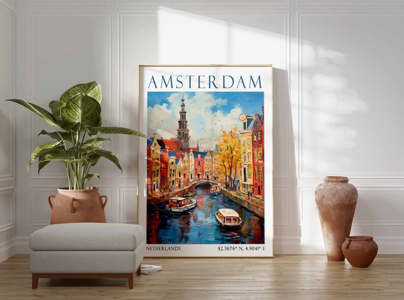 May include: A vintage travel poster with a colourful illustration of Amsterdam, Netherlands. The poster features a canal with boats, buildings, and a tall church steeple. The text on the poster reads "AMSTERDAM, NETHERLANDS, 52.3676&deg; N, 4.9041&deg; E".
