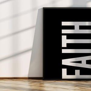 May include: Black and white poster with the word "FAITH" in large, white letters on a black background.