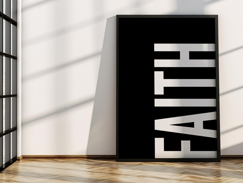 May include: Black and white poster with the word "FAITH" in large, white letters on a black background.