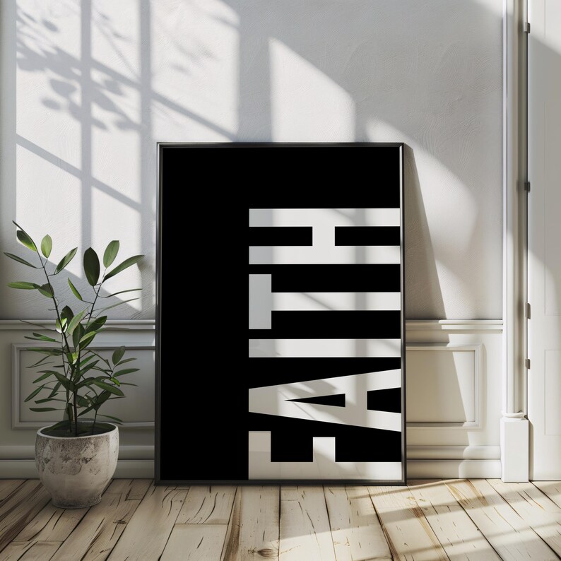 May include: Black and white poster with the word "FAITH" printed in white letters on a black background.