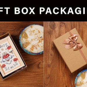 May include: The image shows gift box packaging with a brown box tied with a ribbon, a box with a card, and two candles. The card in the box has the text "THE PERFECT MATCH" with a heart and floral design. The text "GIFT BOX PACKAGING" is at the top.