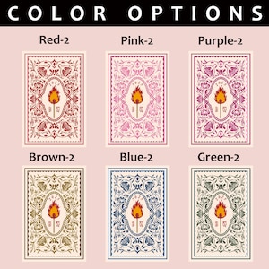 May include: A display of six playing cards, each with a different color border and background. The cards feature a central design of a torch within an oval frame, surrounded by floral patterns. The text "COLOR OPTIONS" is at the top.