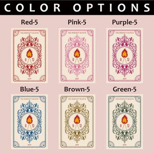 May include: A display of six cards, each featuring a central torch design within an ornate frame. The cards are in various colors: red, pink, purple, blue, brown, and green. Each card has the text "THE PERFECT MATCH" and "2025".