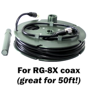 May include: A dark green plastic cable spool wound with black coaxial cable, featuring a metallic connector and a separate dark green cylindrical rod. The text below reads: For RG-8X coax (great for 50ft!).