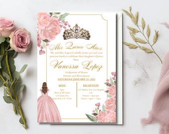 May include: A Quinceañera invitation with a pink floral design and gold accents. The invitation features a crown, a silhouette of a girl in a pink dress, and the text "Mis Quince Años" and "Vanessa Lopez". The invitation includes details for the Mass and Reception, including the date, time, and location.