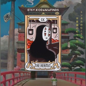 May include: A gold and white enamel pin featuring No Face from the animated film Spirited Away. The pin is a tarot card design with the number IX and the words "The Hermit" on it. The background of the pin is a scene from the film with a red bridge and a young girl standing on it.
