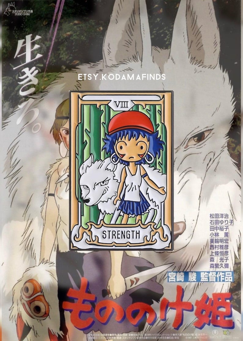 May include: A white enamel pin featuring a cartoon character from the movie Princess Mononoke. The character is a young girl with blue hair and a red hat. She is standing next to a white wolf. The pin is a tarot card design with the number VIII and the word STRENGTH. The background is green and white.