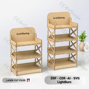 May include: Two wooden display shelves with the text "UcArtDesing" on the top. The shelves have an X-shaped support structure and three shelves. The image also includes the text "LASER CUT FILES" and "DXF - CDR -AI - SVG LightBurn".
