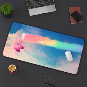 May include: A pink and white character with a rainbow trail behind it on a blue and white cloud background. The character is on a mouse pad with a white mouse.